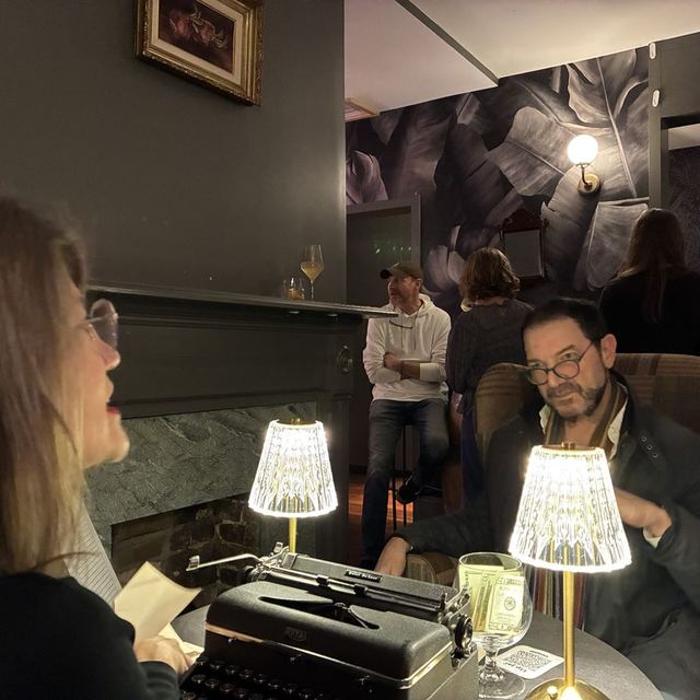 Typewriter poetry table with crystal lamps at Poem-crafted Cocktails at Speakeasy & Whiskey Bar