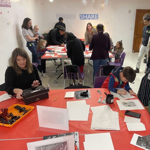 Children and adults at a community typewriter poetry and art event
