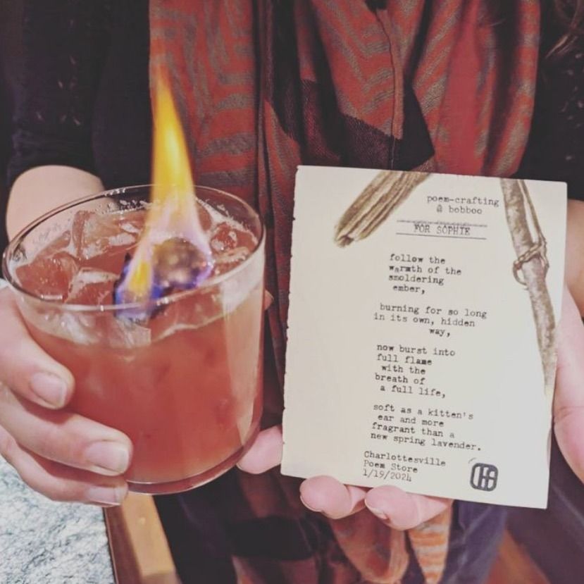 The trademarked Poem-Crafted Cocktails experience by Charlottesville Poem Store, featuring live typewriter poetry at a luxury hotel bar